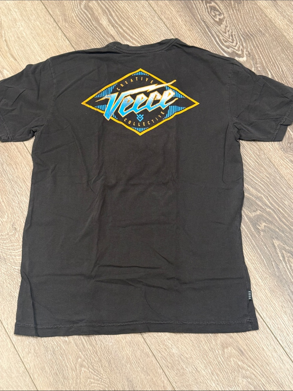 Buckle Black Short Sleeve Tee with Blue & Yellow Graphic